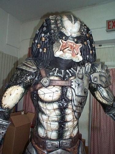 here is the 1/1 predator...its not a full figure. the back is flat so i can be placed against a wall...but its still pretty cool. the factory paint job sucked big ass...so i repainted him.  Here he is almost done!